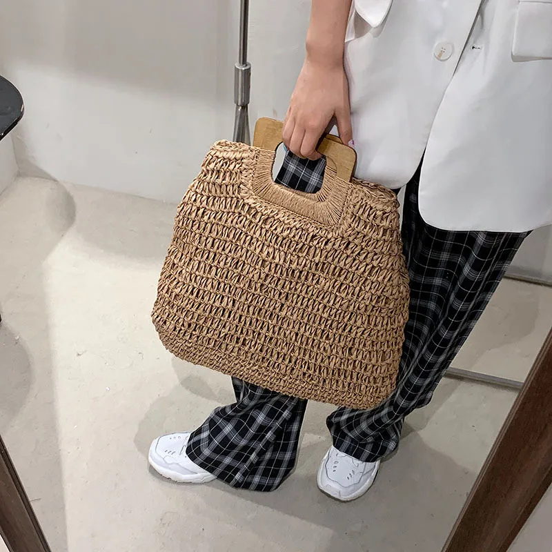 Borsa estiva in paglia intrecciata borsa con manico in legno femminile borsa da spiaggia da viaggio di grande capacità Totes stile moda scava fuori