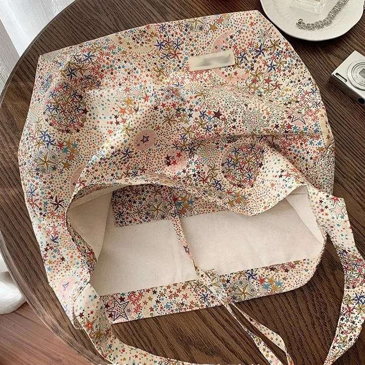 スターシーニッチデザインホーボーバッグ女性用シングルショルダーキャンバスバッグ通勤大容量ファッションおすすめソフトカジュアルハンドバッグ