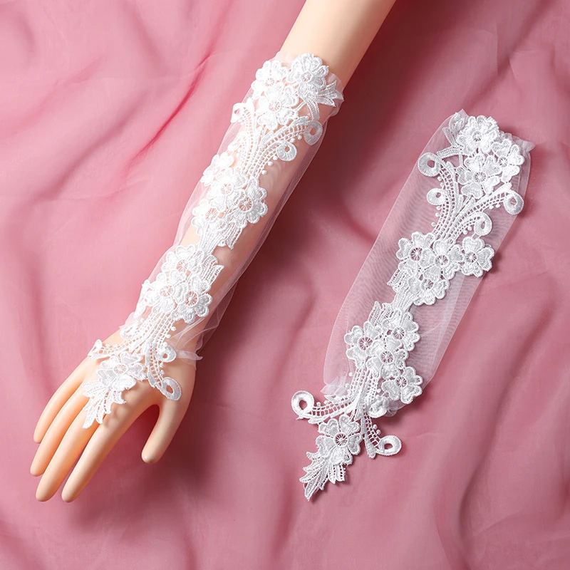 The bride's accessory is a pair of white ring style long gloves suitable for women's wedding parties