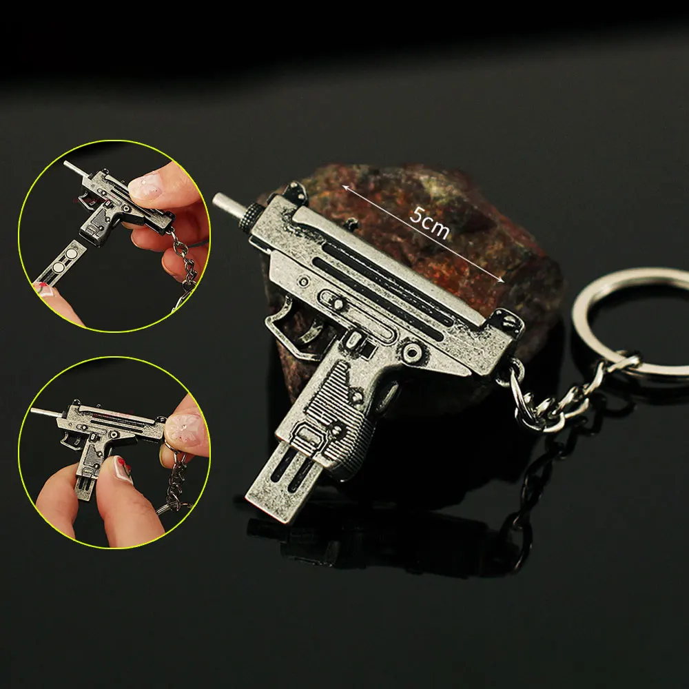 5cm Mini UZI arma de juguete modelo llavero colgante llavero de Metal extraíble decoración manualidades juego figura de acción regalos para niños ZG397