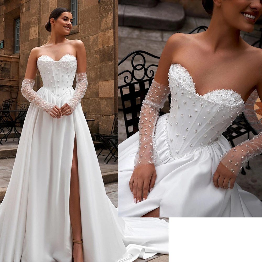 فساتين زفاف لامعة مطرزة بالترتر على شكل قلب من الساتان لحفلات الزفاف على شكل حرف A وأكمام طويلة وفتحة جانبية سويب تراين مصنوعة حسب الطلب 2026