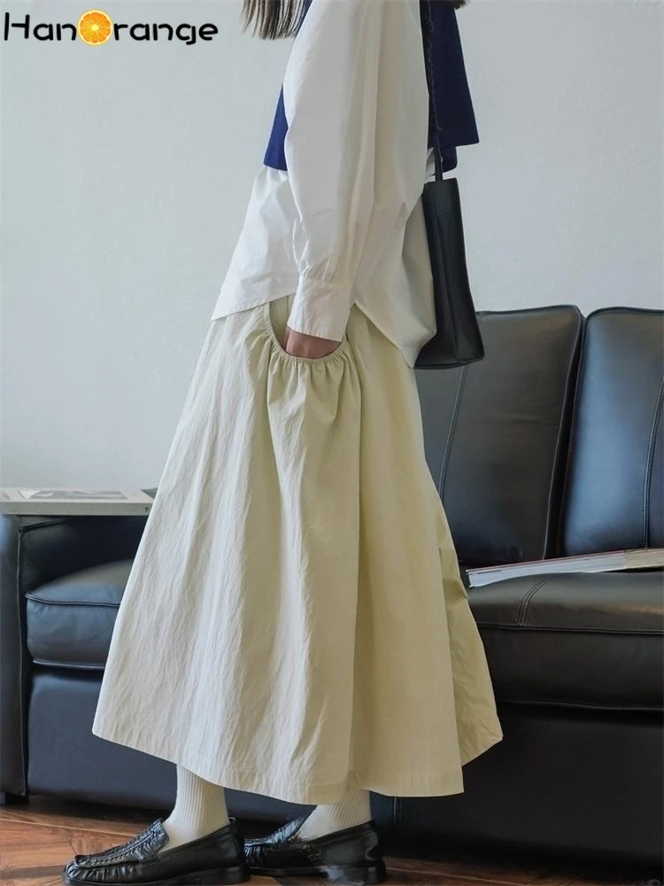 HanOrange 2026 Spring Lazy Fashion Big Pocket Half Skirt Elastic High Waist Age Reducing Midi Skirt Black/Beige Apricot