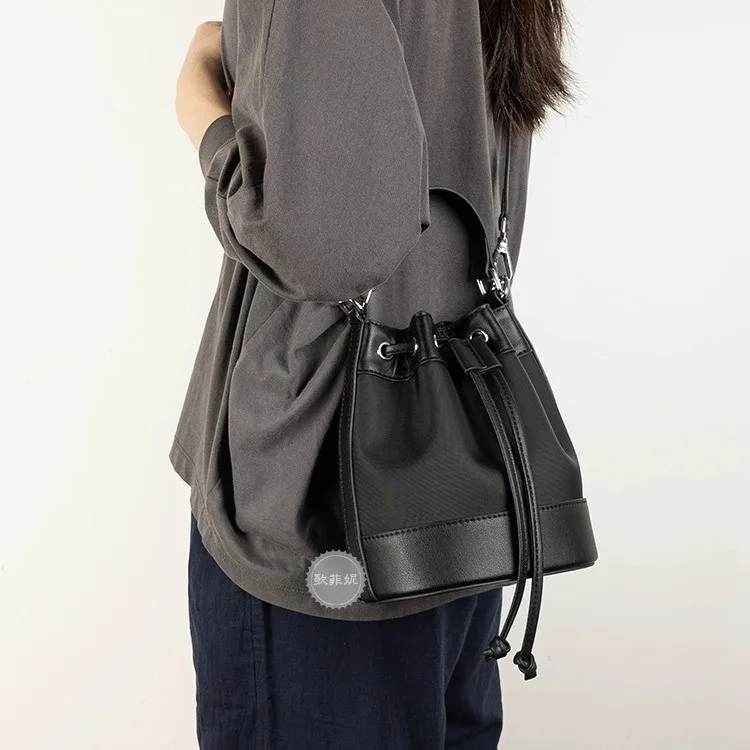 Women's real leather premium shoulder bucket bag vintage drawstring strap mouth diagonal cross commuting small backpack