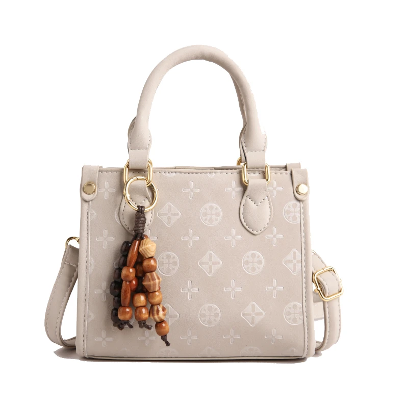 

Уникальная модная винтажная сумка для подгузников: женская сумка через плечо, текстурированная кожаная сумка с простым и стильным дизайном.