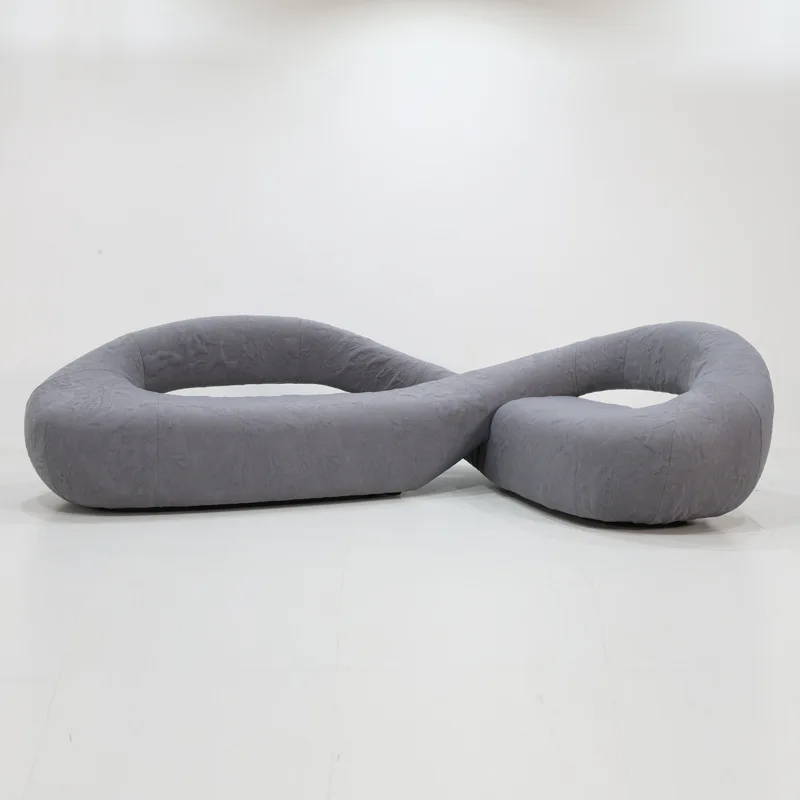 Minimalist irregular sofa, modern living room, wabi-sabi furniture, creative hollowed-out snake design