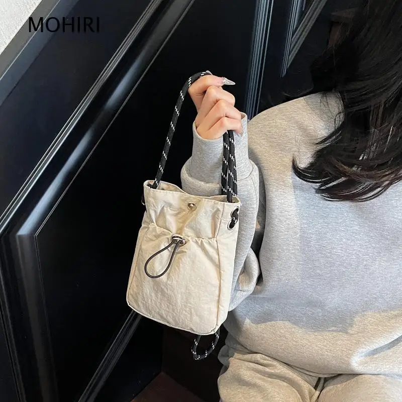 2026 Minimalist Solid Color Drawstring Mini Crossbody Bag Nylon Shoulder Purse for Women Daily and Casual Wear