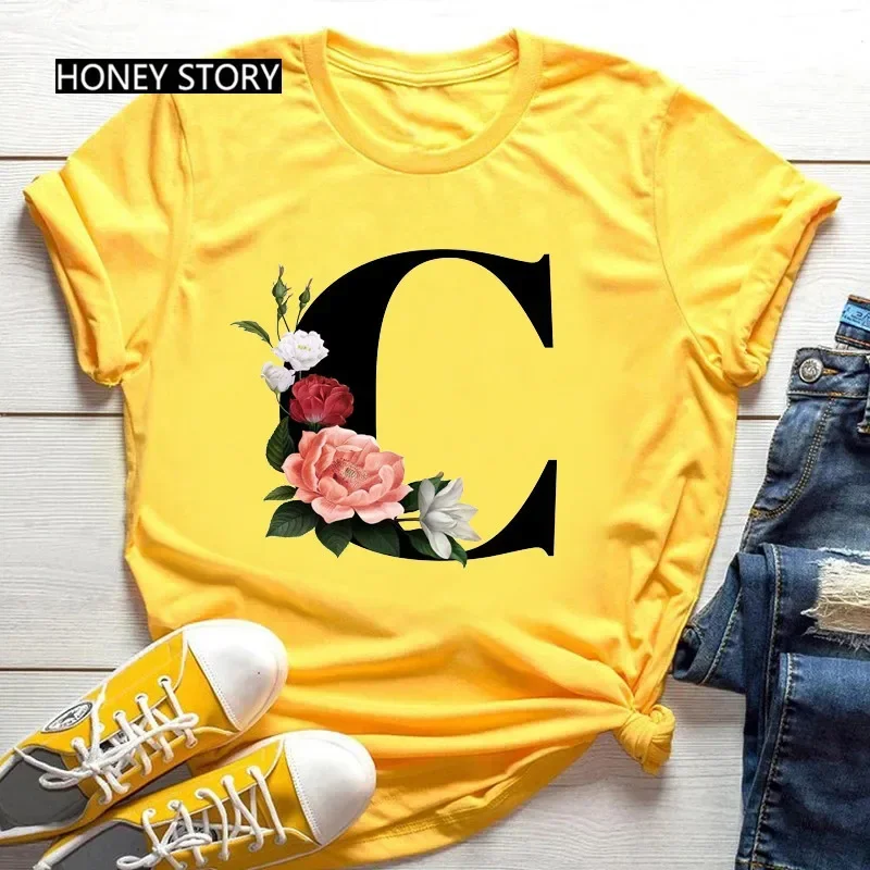 Venta caliente de flores de gran tamaño 26 letras en inglés negro moda tendencia estampado hombres y mujeres Casual camiseta amarilla de manga corta