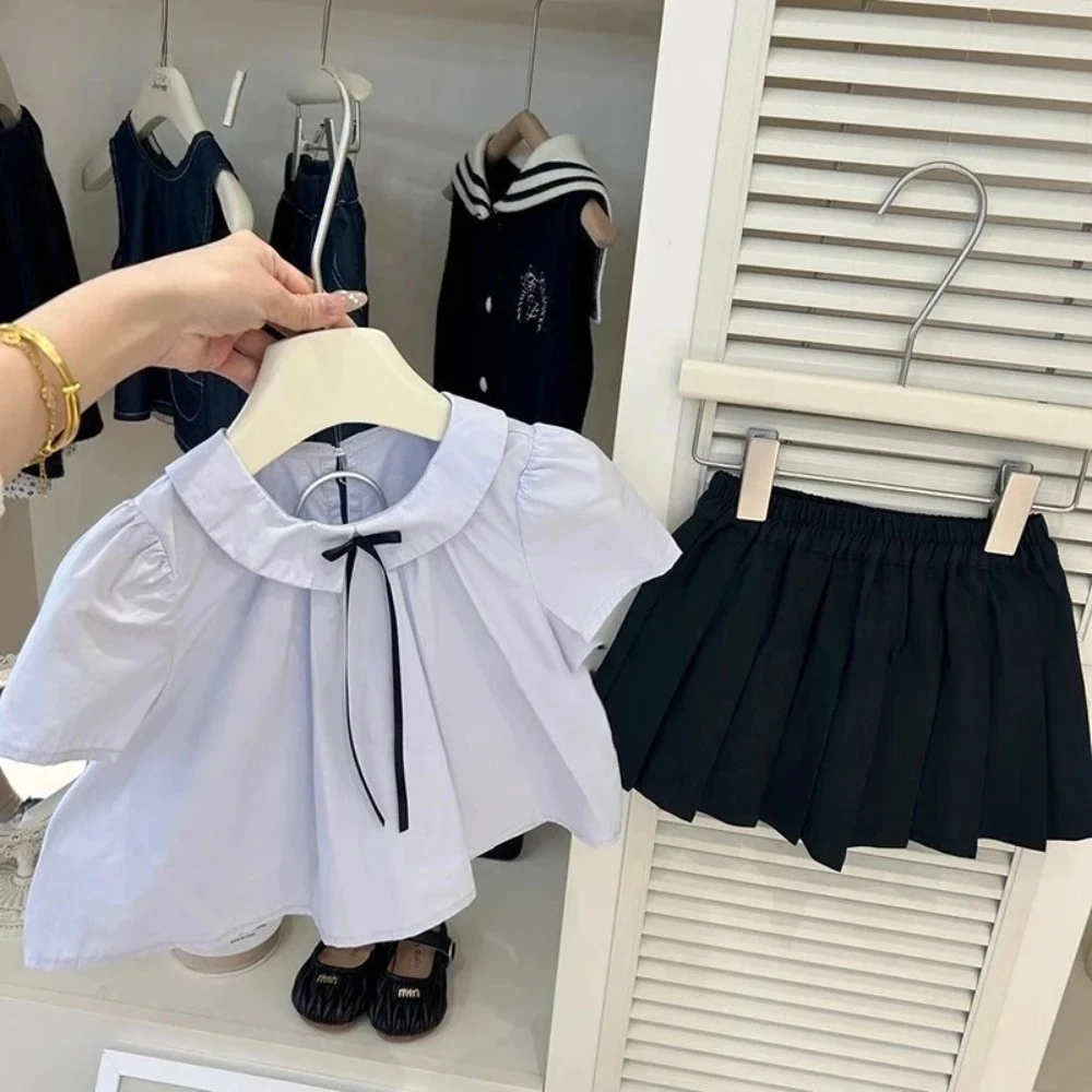 

Korean Version Summer College Style Girls' Clothing Blue Short Sleeved Shirt Top and Pleated Skirt Solid Color Two-piece Set