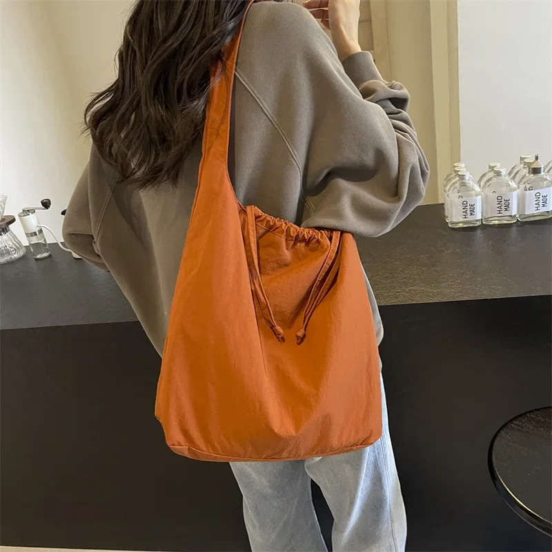 Simple Solid Color Washed Cloth Armpit Commuter Shoulder Bag Casual and Lightweight Ins Wind Drawstring Design Bucket Bag