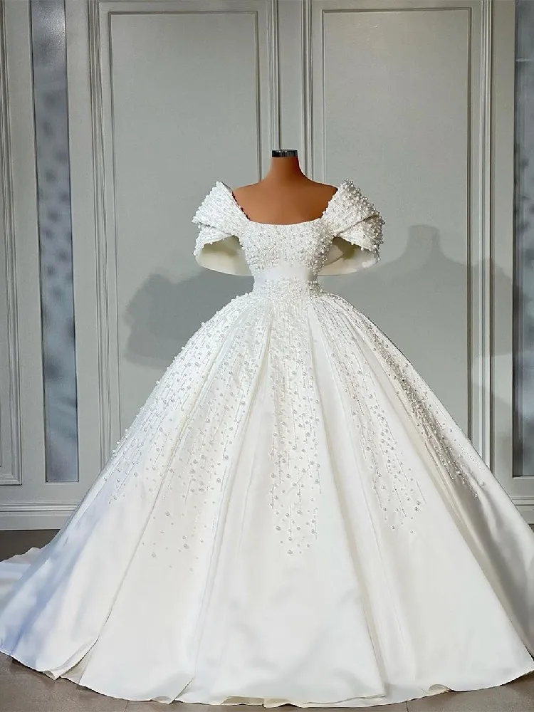 

Elegant Ball Gown Wedding Dresses Sleeveless Bateau Neck Pearls Sequins 3D Appliques Satin Beaded Bridal Gowns Vestina De Novia