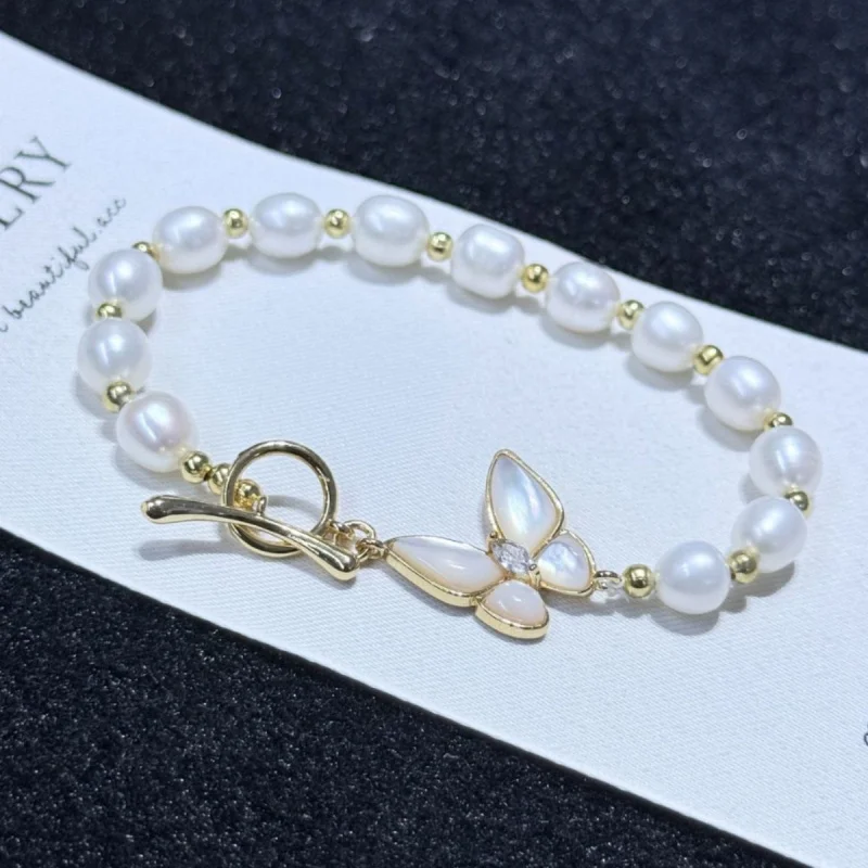 

Natural mother-of-pearl bracelet with freshwater pearls 6-7mm rice-shaped beads