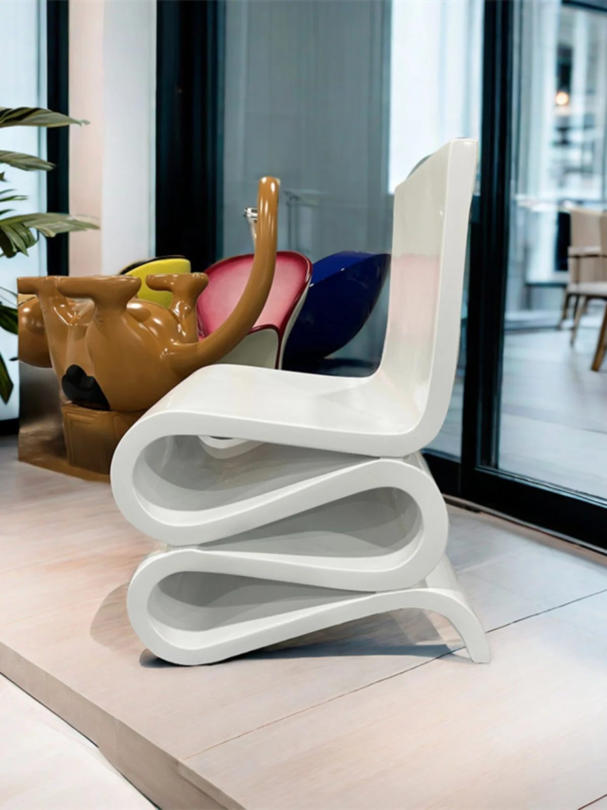 

Designer: FRP kneeling , art S-shaped curved chair, imitation wood grain , painted leisure chair, book , special-shaped