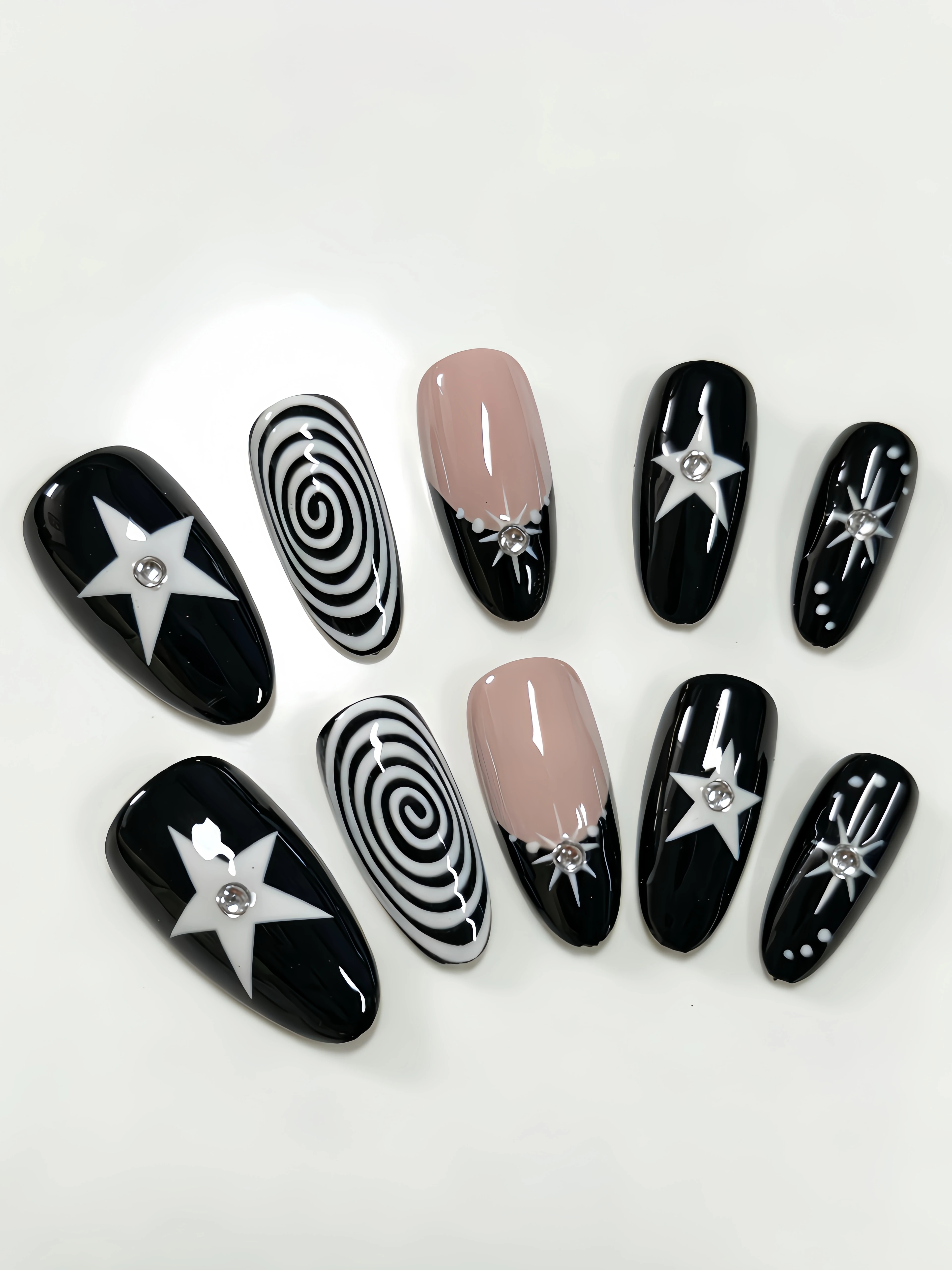 10 Medium-Length Almond-Shaped Press-On Nails, with Black and Nude Apricot as the Main Colors, Featuring Star-Shaped Rhinestones, Threaded Star Designs, French-Style Outlining, Y2K Gothic Nail Art Patches, Suitable for Office Workers, Students, Sweet and Cool Girls, and Trendy Girls' Daily Outings, Bar Nights, Music Festivals, and Vacation Seasons, Offering a Unique and Personalized Style. Includes One Jelly Glue and One Nail File