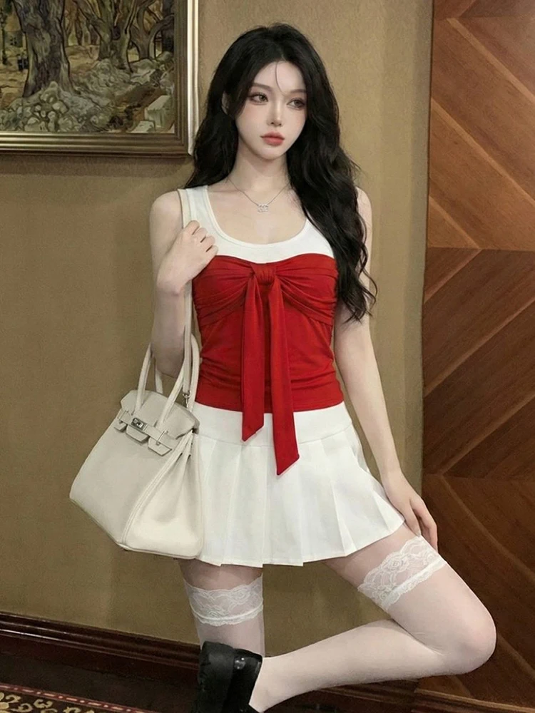 

Sexy contrasting color round neck versatile slim fit bow vest with chest cushion high waist pleated short skirt two piece set