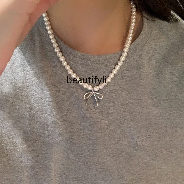 

Natural freshwater bow pearl necklace women's niche design collarbone chain new millet bead neck chain