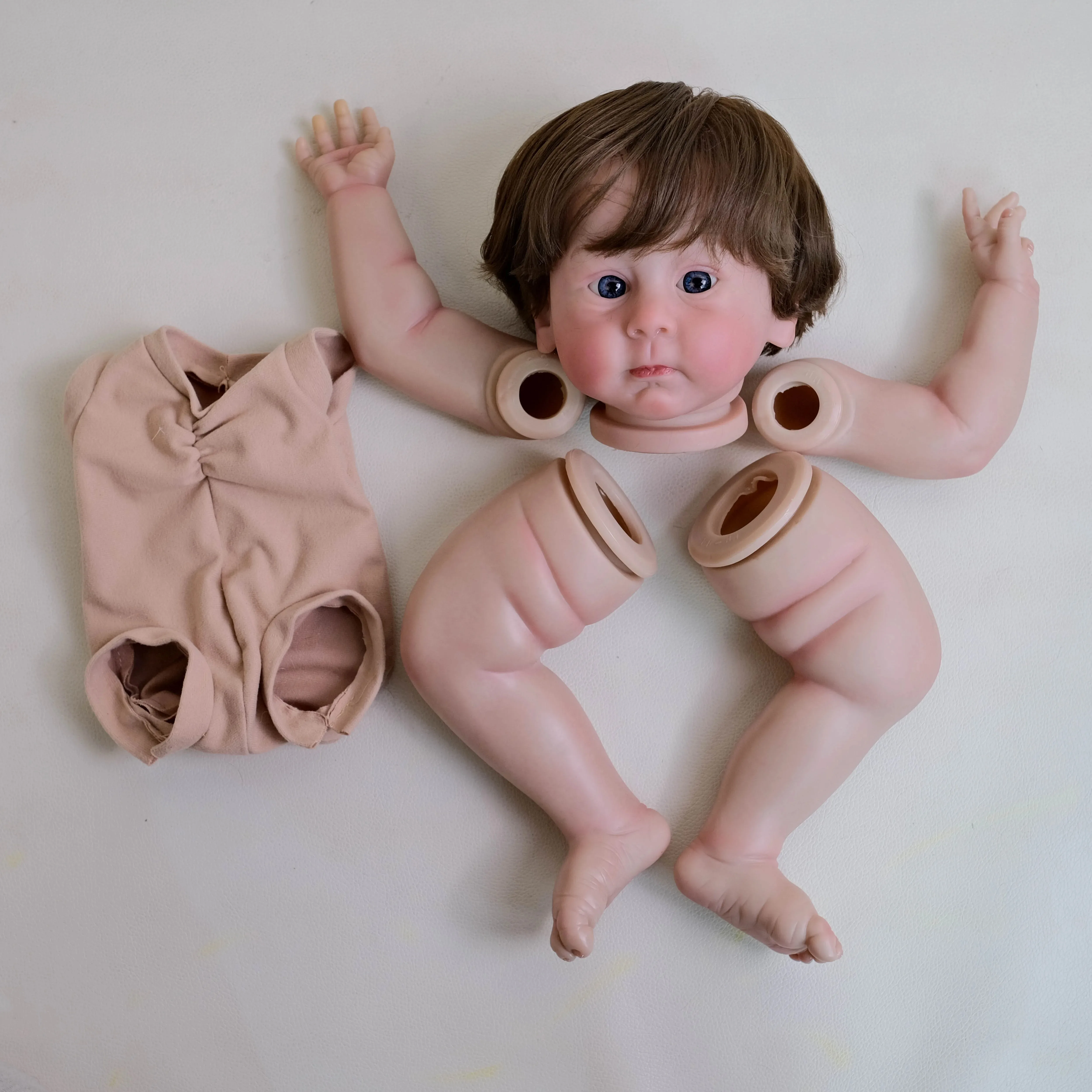 

Huxley 22inch Reborn Doll Kit Lifelike Unassembled Multiple Layers Painting Doll Parts with Visible Veins Hand Rooted Brown Hair