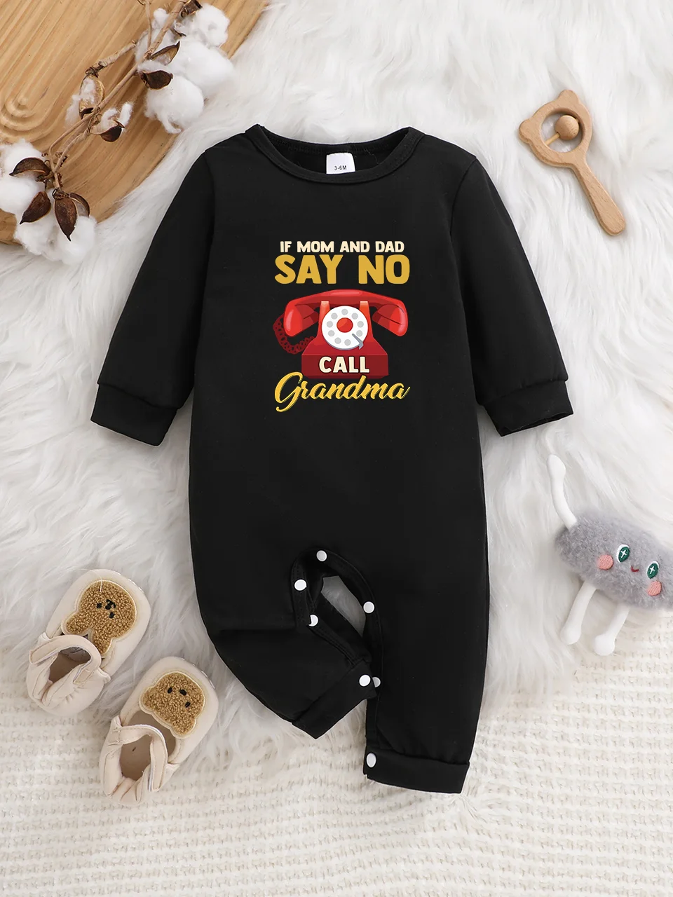 A baby long-sleeved onesie with interesting letter prints. It features a buttoned design for easy putting on and taking off