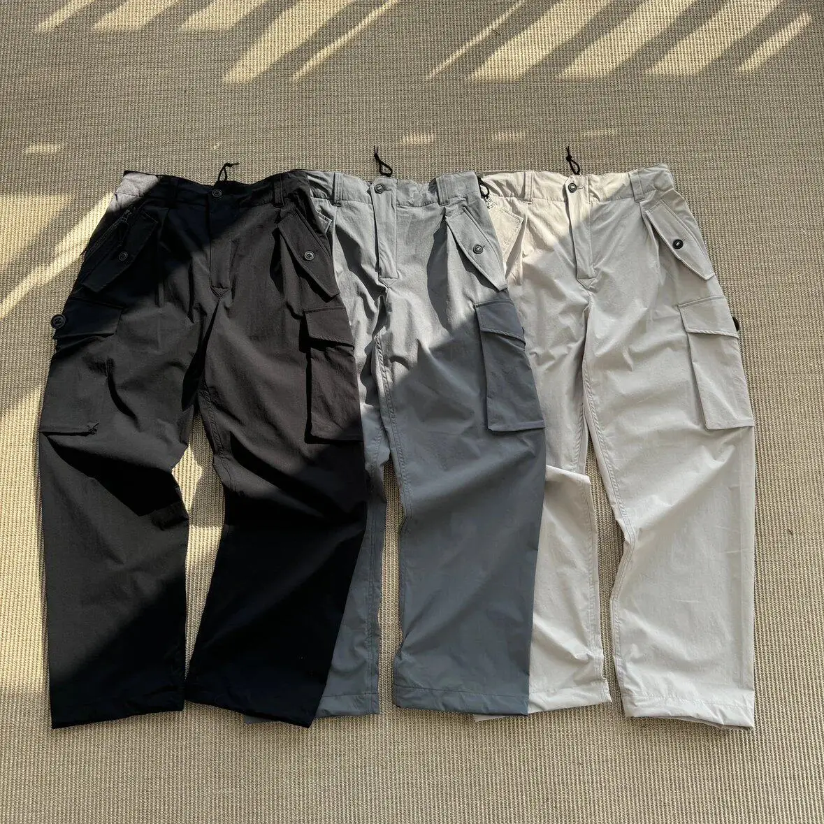 

NH thin nylon multi-pocket trousers with adjustable cuffs and cargo silhouette
