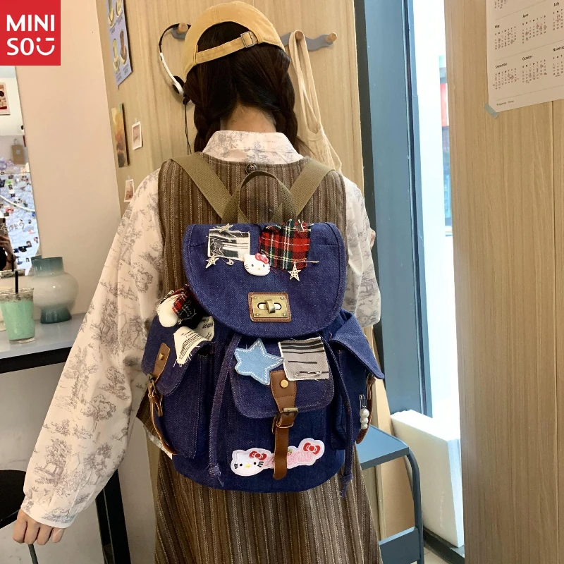 Miniso Nueva mochila Hello Kitty Bone, patchwork de mezclilla desgastado, mochila con bloques de color