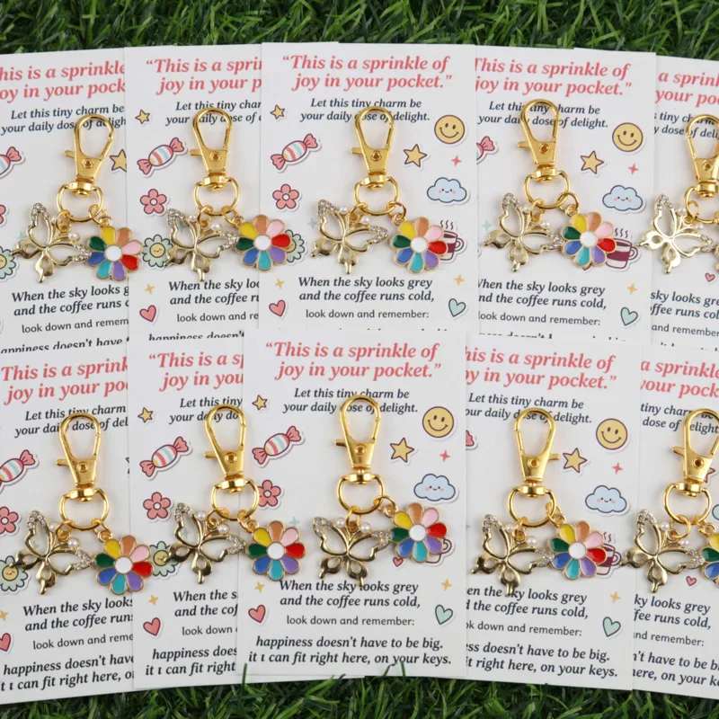 10A whimsical butterfly keychain set With rainbow flower pendant Comes with an inspirational greeting card Can write blessing me