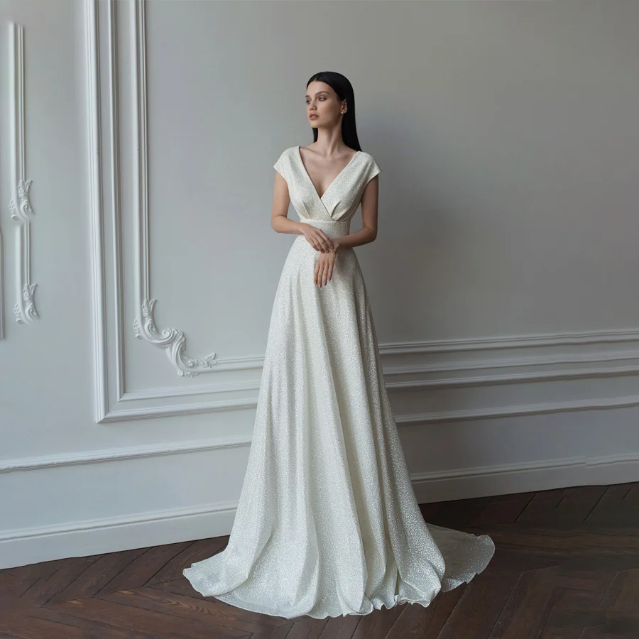 

Striking Sequin A-line Wedding Dress with Daring Deep V-neckline Glistening Bridal Gown Features Key-hole Back And Watteau Train