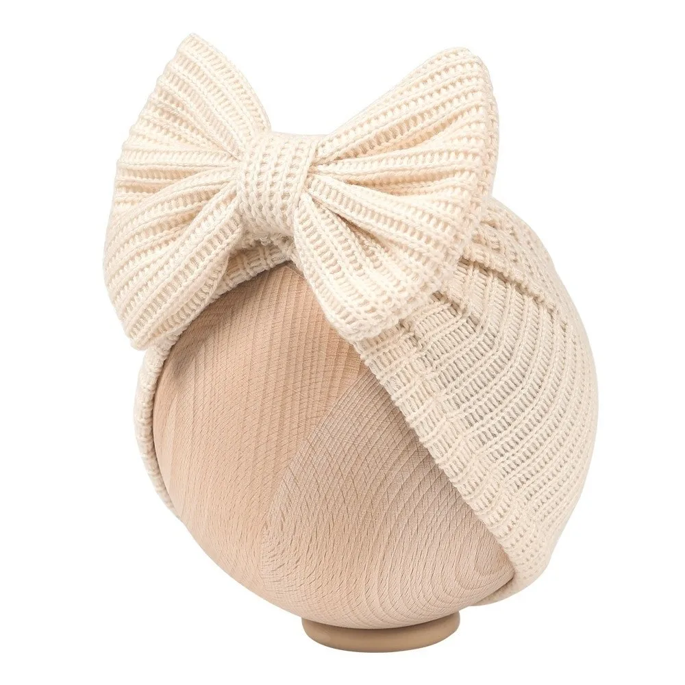 جديد لطيف Bowknot محبوك عمامة بلون دافئ الرضع قبعة قبعة مطاطا البلوز كاب Headerap