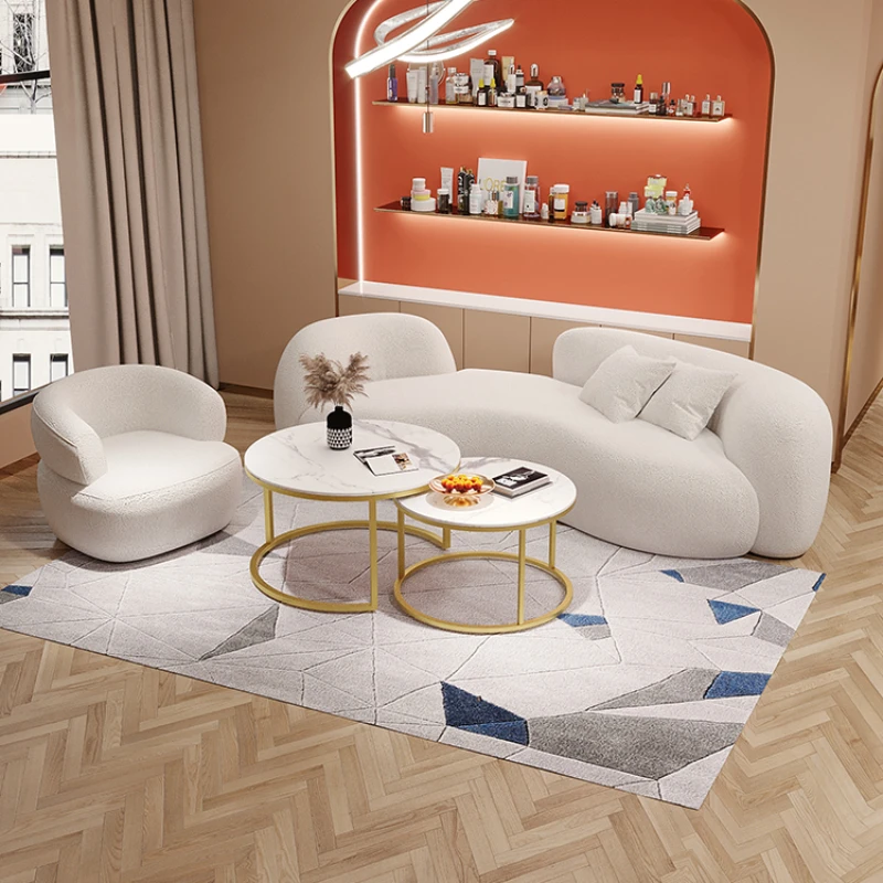 Cream style irregular beauty salon with curved sofas, modern and minimalist small unit design