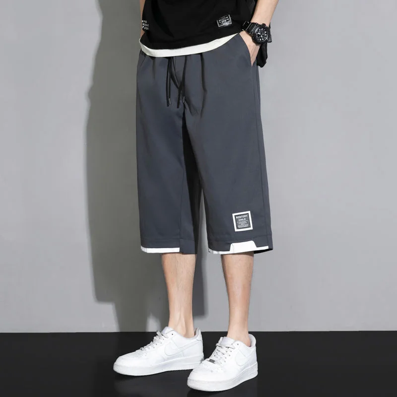 Pantaloncini Casual versatili da uomo estivi Koreon Streetwear moda elastico in vita larghi kaki nero verde Big Size nuovi pantaloni Capri 8XL