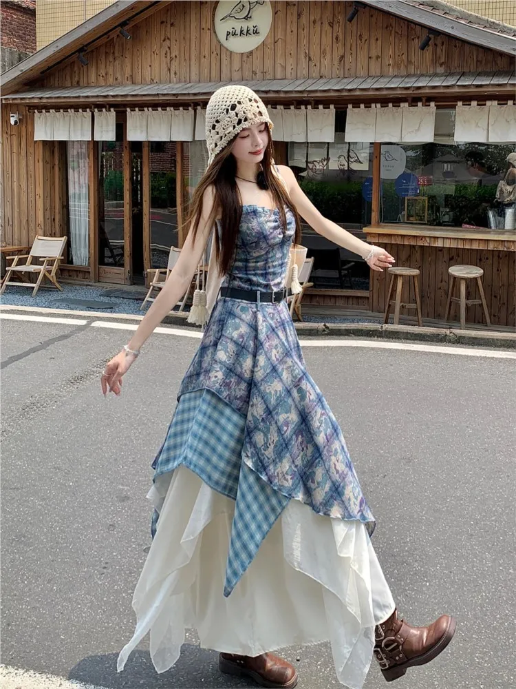A printed halter top is layered over an irregular ruffled travel dress suit