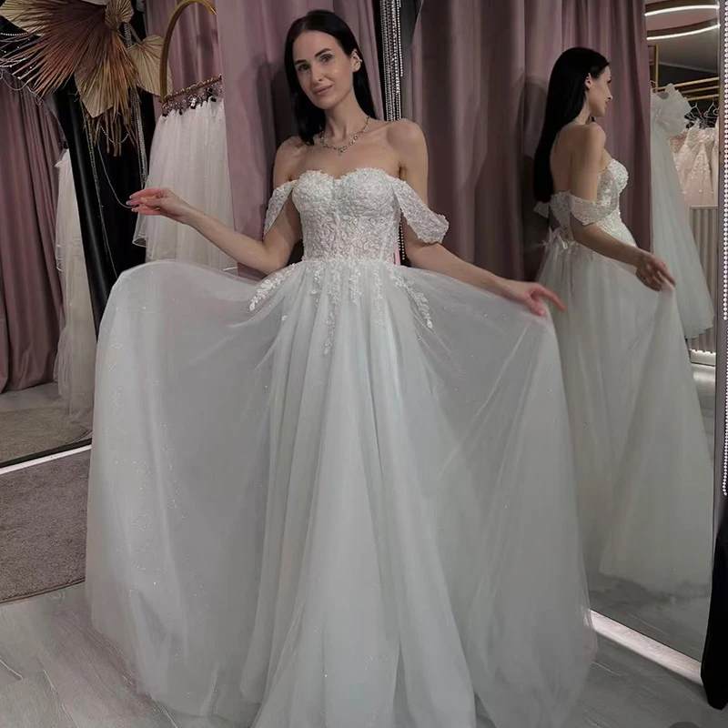 فستان زفاف مكشوف الكتفين من الأورجانزا مع تطريز على شكل حرف a بطول الأرض فستان زفاف مخصص برباط فيستدو دي نوفيا ترتر