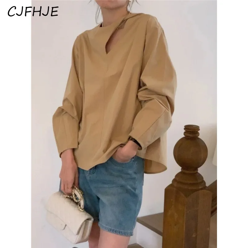 CJFHJE Spring New Women's Solid Color Round Neck Shirt Korean Minimalist Fashion Design Twisted Hole Long Sleeve Women Shirt Top