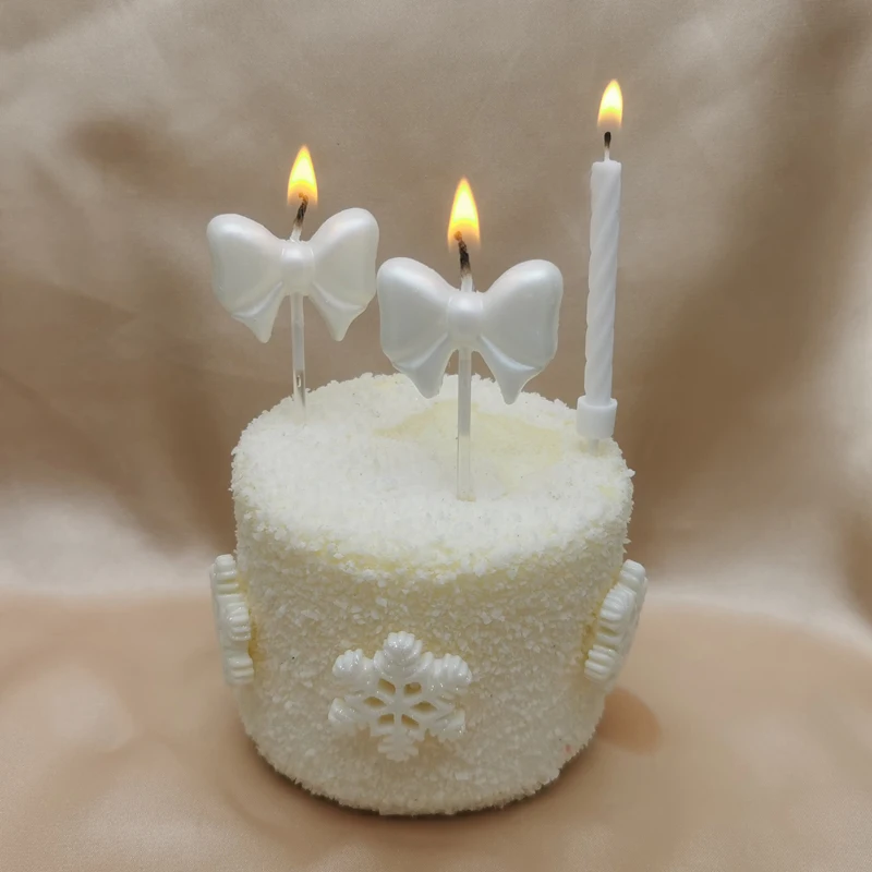 White pink bow birthday candle