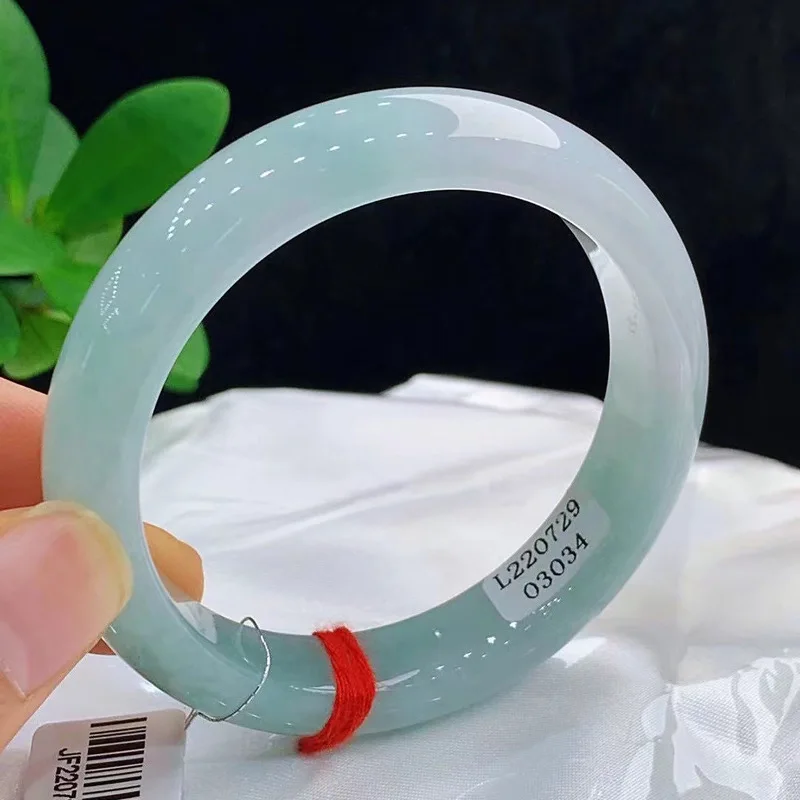 Authentic natural Burmese jade bracelet featuring a light green translucent ice-like jadeite a high-quality and popular item