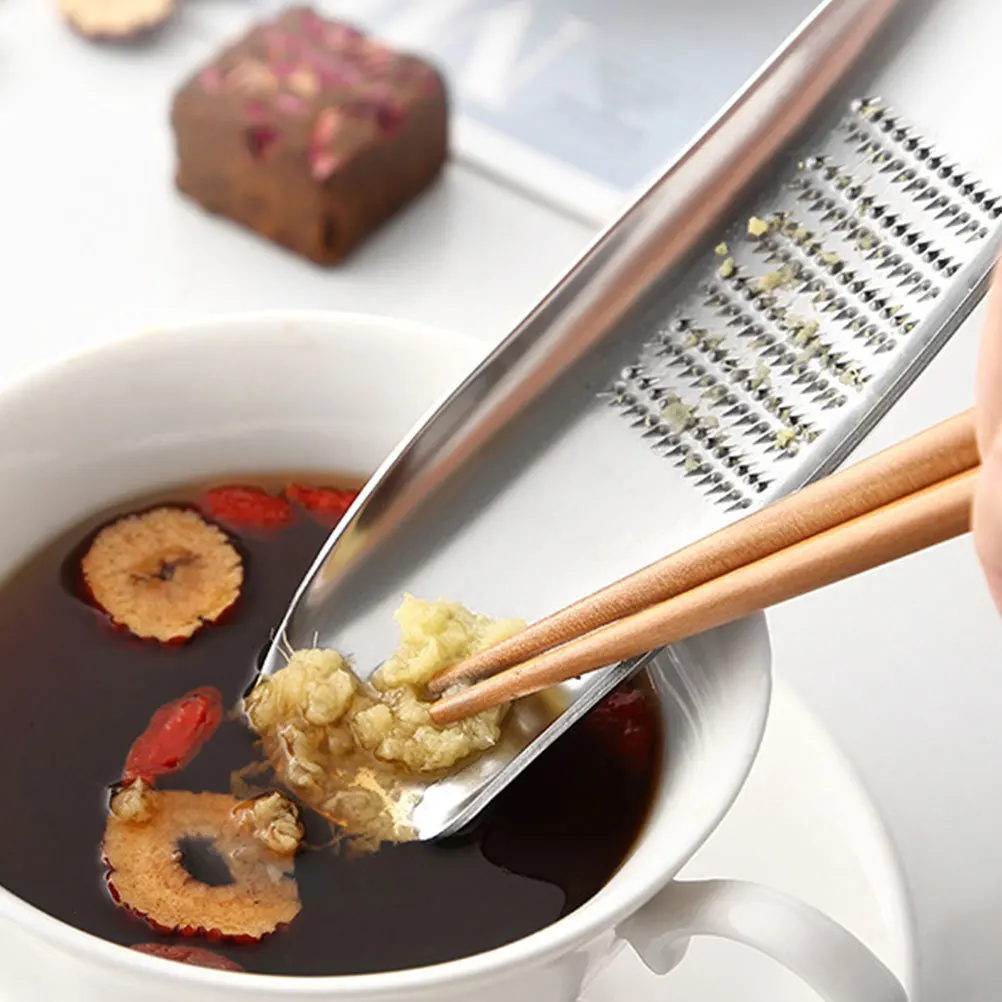 

Stainless Steel Ginger Garlic Multi-Use Kitchen Grater For Grating Ginger Garlic Fruit Easy Clean Hand Grater Household