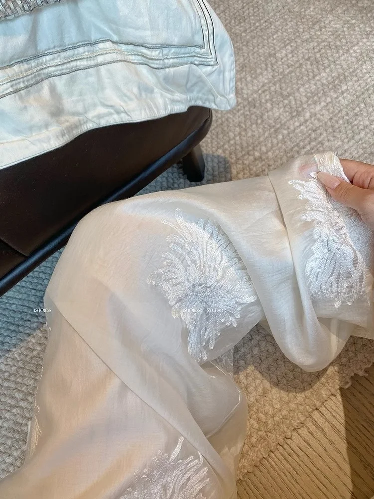 Pantaloni a gamba larga ricamati bianchi Pantaloni estivi larghi dal taglio dritto da donna Nuovi pantaloni casual cinesi Sle Pendolari Sle