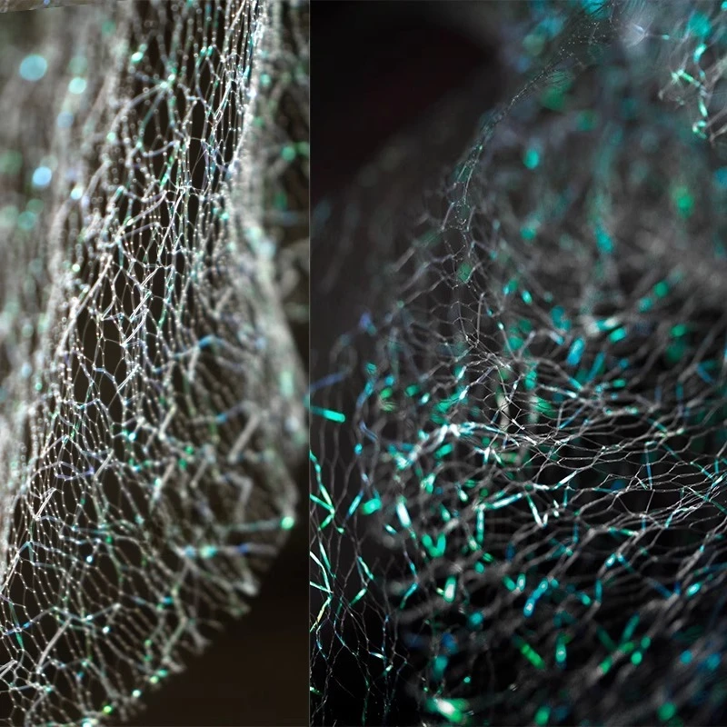 

Mermaid Iridescent Laser Green Sheer Mesh Fabric with Hollow Texture for DIY Costume Designer Fashion Glossy Textile Fabric