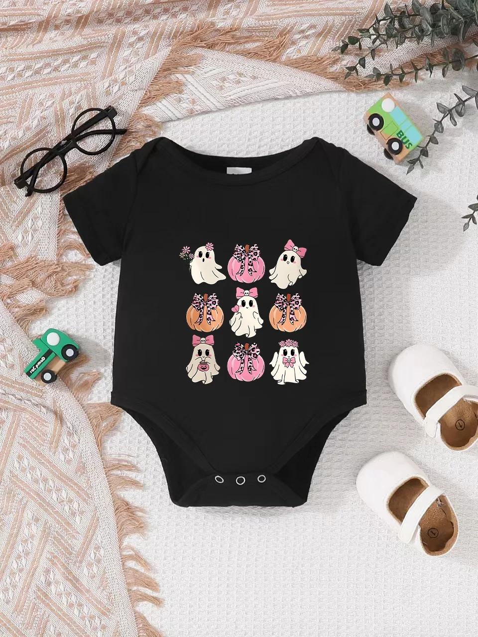 Playful letter-printed baby short-sleeve triangle bodysuit. Button closure for easy dressing, machine washable