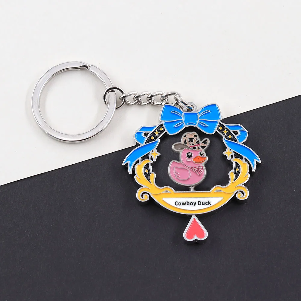 Lustiger rotierender Cowboy-Enten-Schlüsselanhänger, doppelseitig drehbarer rosa Enten-Schlüsselring, Kawaii-Tier-Metallanhänger, Schmuck für Rucksack und Tasche – Detail 8