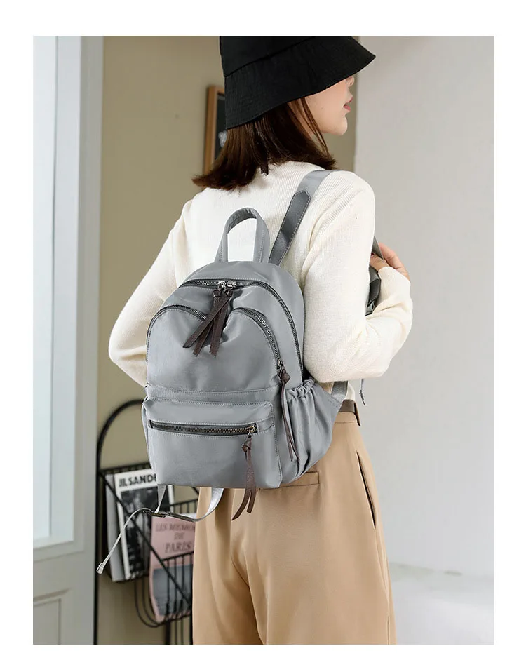 The new Nylon waterproof Hgh Quality travel backpacks is simple, versatile and has a large capacity for women schoolbag bolas