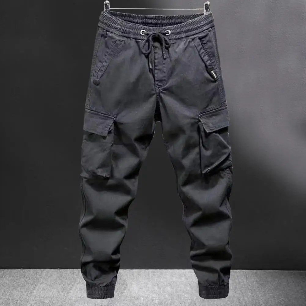 Celana Kargo Wanita dengan Banyak Saku Pinggang Elastis Tali Pergelangan Kaki Celana Panjang Luar Ruangan Pria Longgar Ukuran Besar untuk Perjalanan Berkemah dan Mendaki