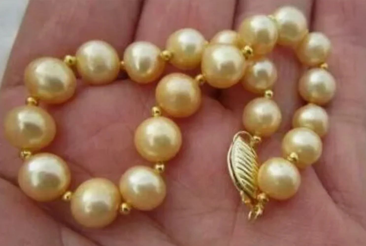 

Large quantity of AAA 9-10mm round South Sea gold pearl bracelet 7.5-8 inches 14Kp gold