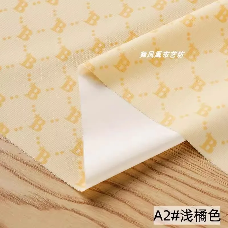 Golden Fashion Printed Letter Fabric Artificial Leather Waterproof Micro Elastic Clothing Bag Designer Fabric Apparel Diy Sewing