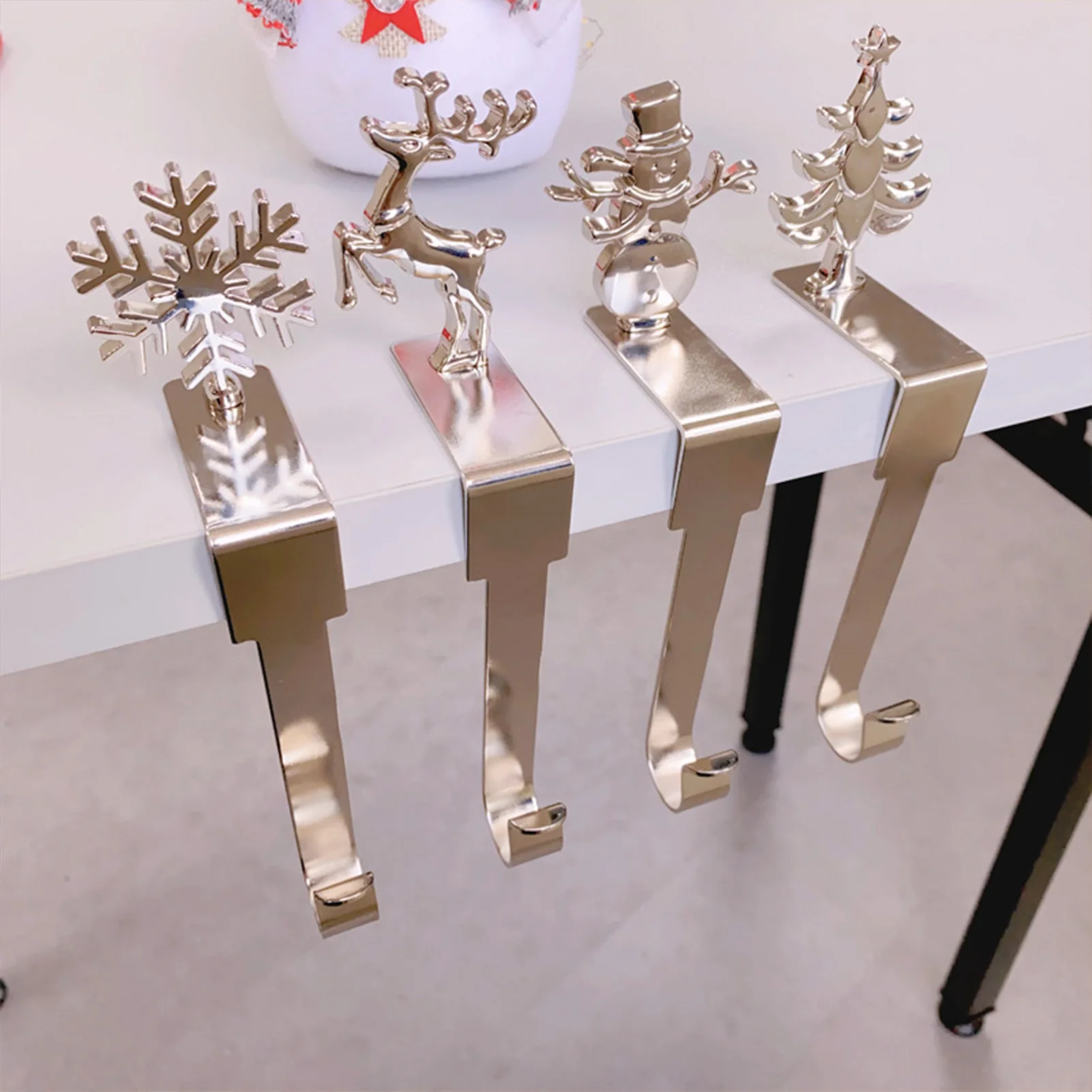 

4pcs Christmas Stocking Holder Metal Xmas Tree Elk Snowflake Decorative Stocking Holder Christmas Sock Hook for Mantle Fireplace