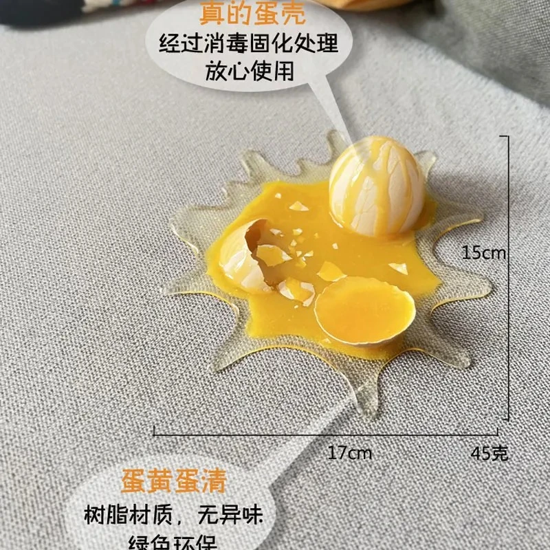 Realistischer Handyhalter mit gebrochenem Ei, lustiges Streichspielzeug mit Dekompressionsstütze für Schreibtischdekoration, Gag-Geschenk für Freunde