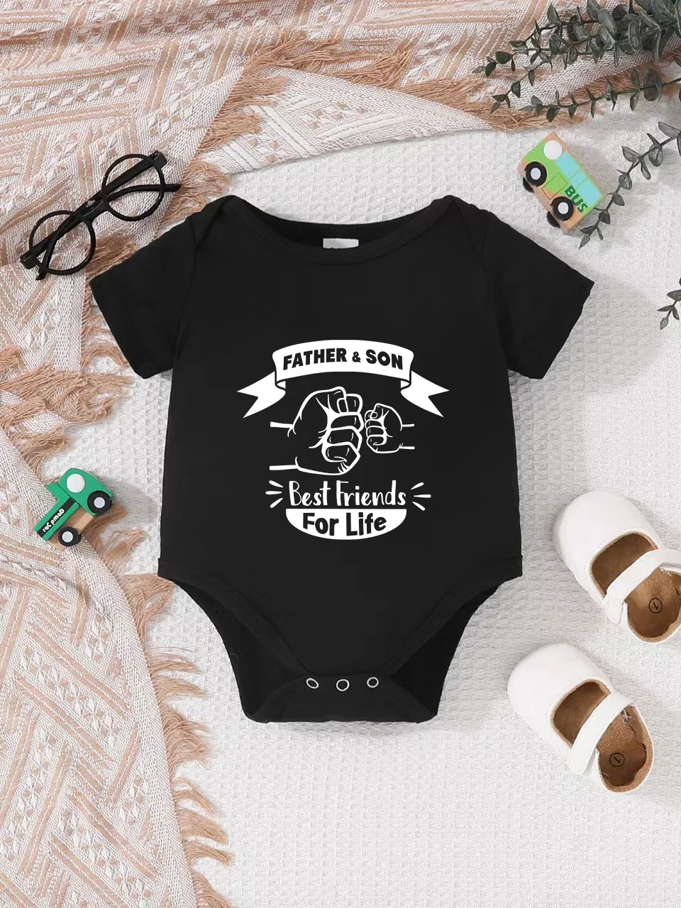 Playful letter-printed baby short-sleeve triangle bodysuit. Button closure for easy dressing, machine washable
