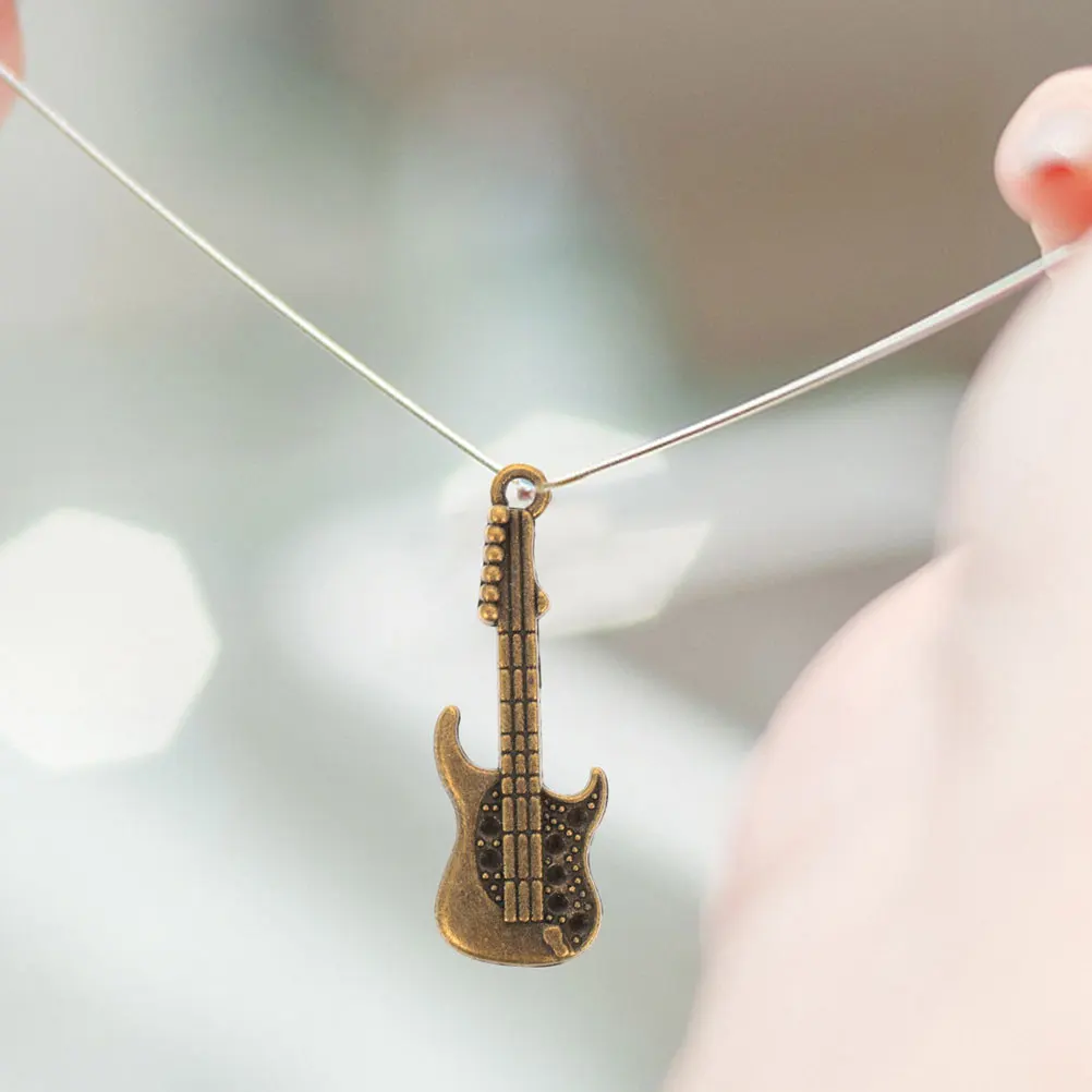 

100 Pcs Guitar Pendant Phone Case Accessories Retro Mini Guitar Charms Craft Decor DIY Ornaments PHONE SHELL DECORATIONS A1704