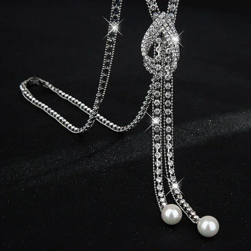 

2025 Necklace, women's claw chain, full diamonds, water drop geometric long sweater chain, versatile and fashionable necklace