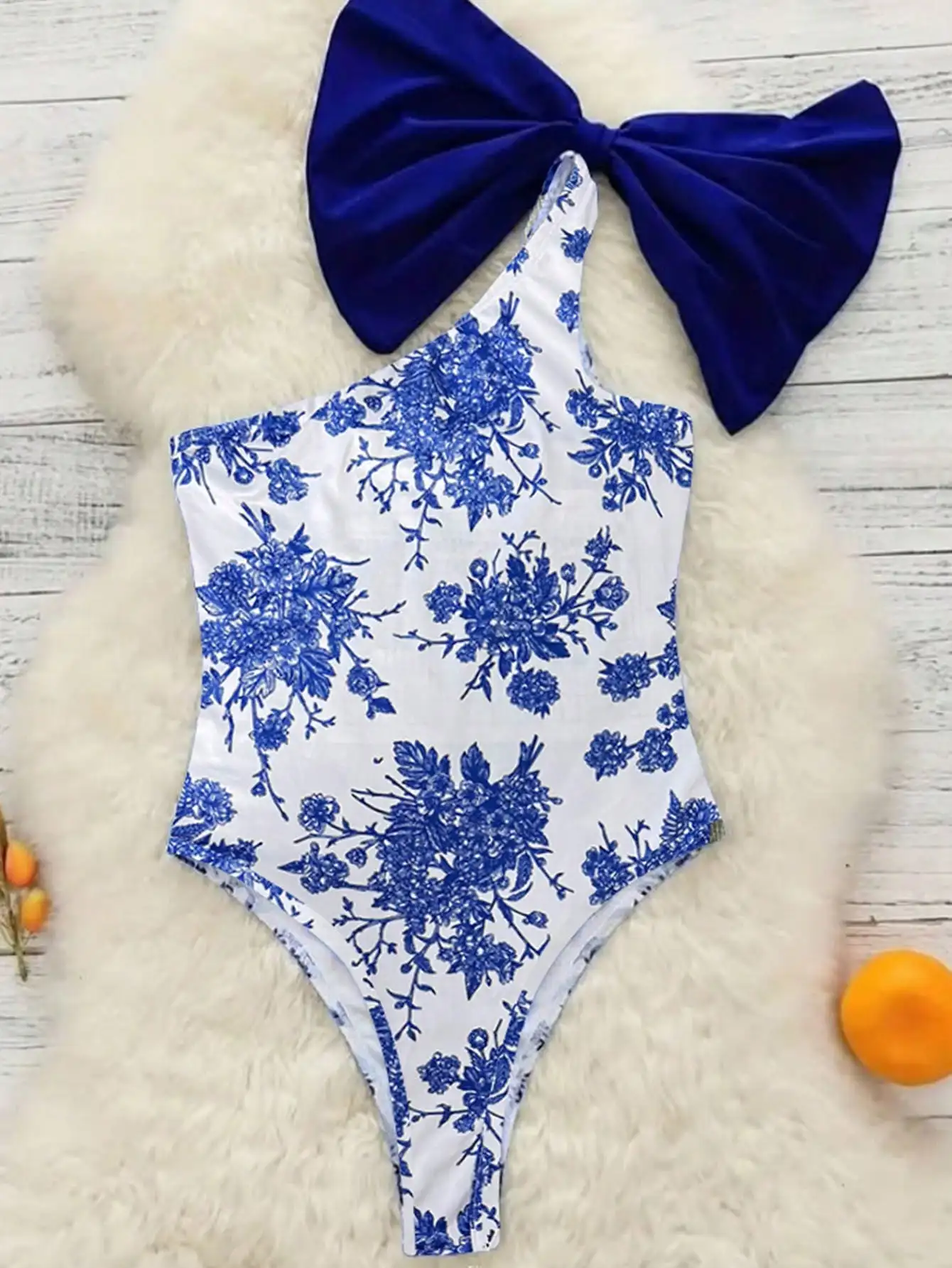2025 new European and American export one-piece bikini, blue and white printed diagonal collar, bow shoulder strap, tight and se