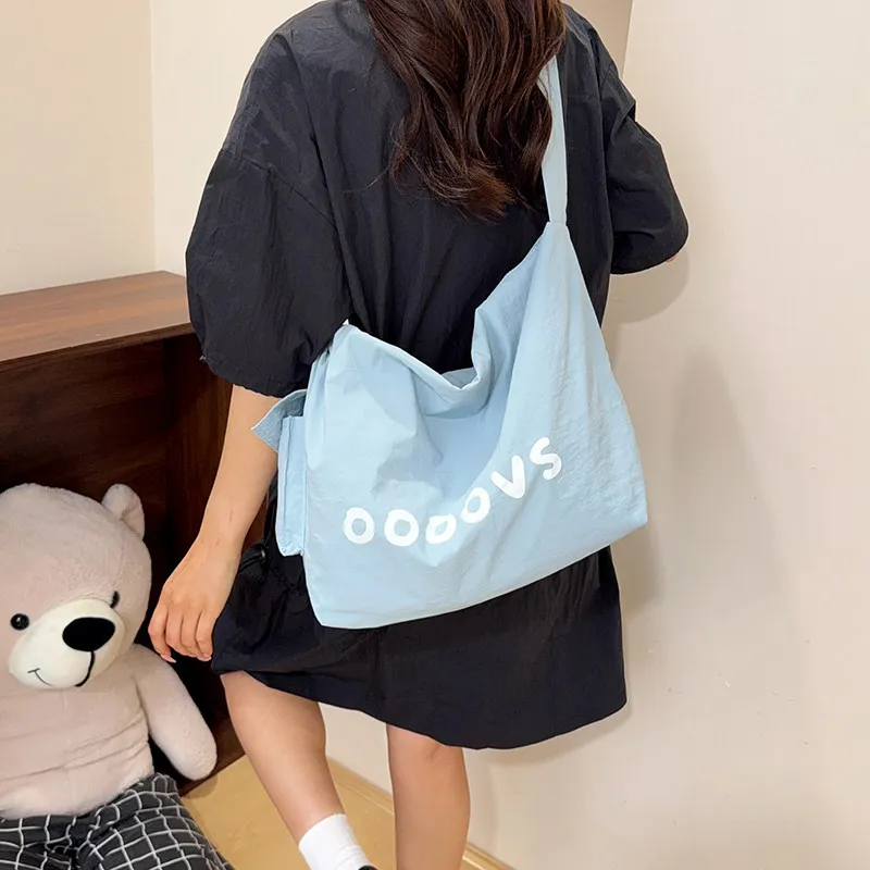 Korean StyleinsCasual large-capacity canvas letter-print tote bag, simple summer commuter versatile crossbody bag for women