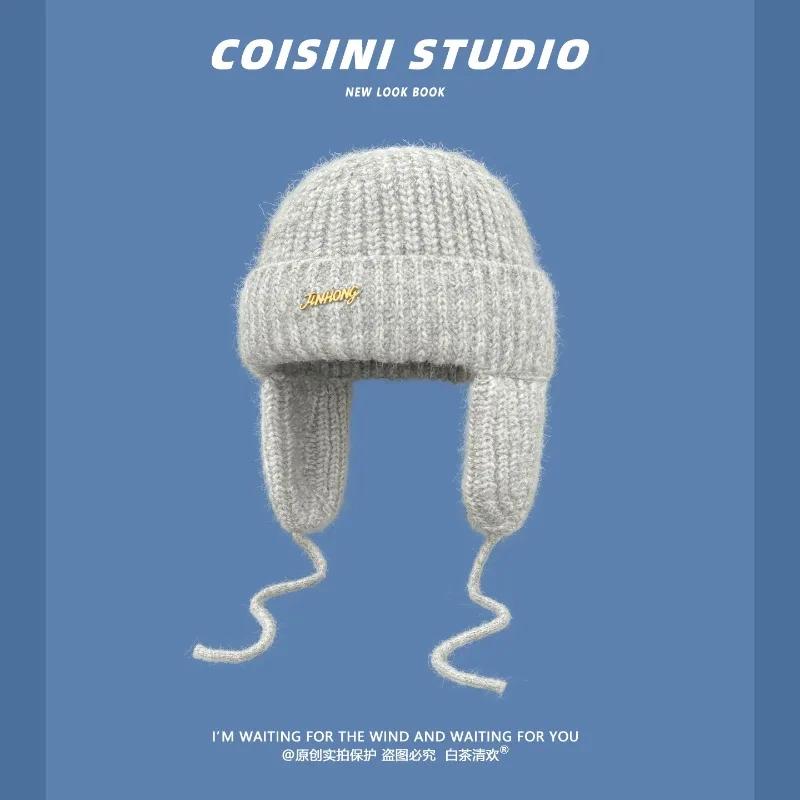 Women Fuzzy Knit Earflap Beanies with Drawstring Winter Warm Soft Knitted Hat Metal Letter Label Wind‑proof Ear Protection Cap